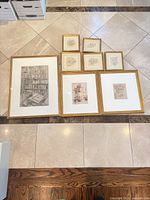 All eight gold framed prints laid out