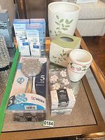 Group shot showing showerhead package, hooks, ceramic holders, diffuser kits