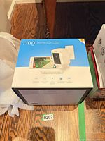 Sealed retail box showing Ring Spotlight Cam Mount labeling and graphics