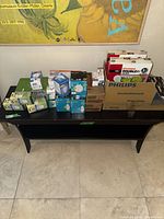 Overall view of console table with all boxed light bulbs and battery packs