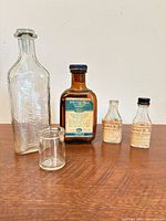 Group shot of five bottles showing sizes, shapes and labels