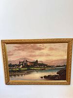 Full view of framed landscape painting