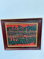 Full view of framed cityscape oil painting