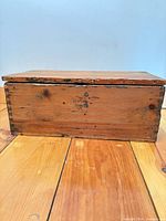 Front and side view of trunk showing dovetail joints and wear