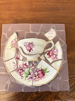 Overall view of square mosaic wall art made from teacup and saucer pieces