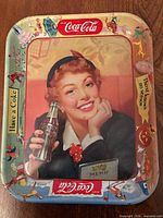 Full view of Coca-Cola tray front showing central graphic and border