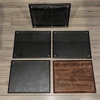 Top-down view of all five document frames showing finishes and condition