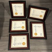 Front view of all five document frames showing design and color