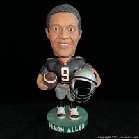 Front view of Damon Allen bobblehead showing uniform, football, helmet, and base text
