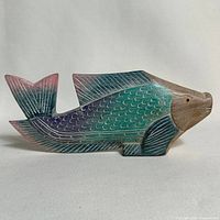 Front right view of carved wood fish showing paint and carving details