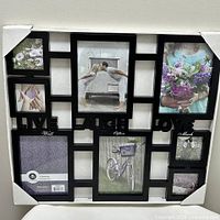 Front view of packaged black 18x20 collage frame showing eight openings and Live Laugh Love text