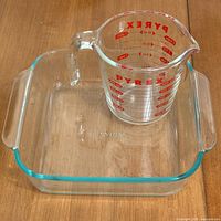 Measuring cup inside square baking dish showing overall view