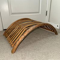 Side perspective showing curved bamboo slatted construction