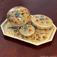 All three boxes and tray grouped, showing scale and design