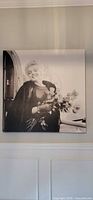 Front view of square canvas print depicting Marilyn Monroe with flowers