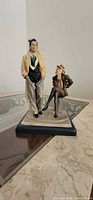 Standing couple figurine showing design and colors