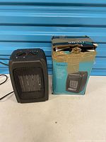 Heater front view beside damaged box