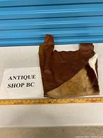 Front view showing leather body and hair-on hide panel