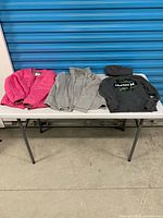 All four garments laid out on table
