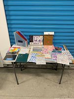 Full table view of all craft and scrapbooking items in lot