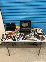 Overview of all tools on table against blue door