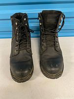 Pair of Ride Tecs black leather lace-up boots, front view