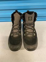 Front view of both boots showing laces, toes, general wear