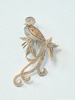 Front view of two-tone bird-of-paradise brooch