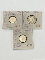 Three French silver coins in 2x2 holders with handwritten notes