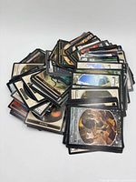 Pile of assorted MTG cards showing tokens and lands