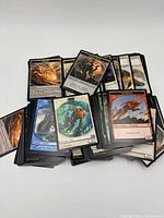 Pile of Magic: The Gathering cards spread to show variety