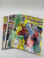 Stack of five bagged comic books, front cover Marvel Tales Spider-Man & X-Men visible