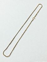 Full view of 24-inch sterling chain necklace laid flat