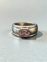 Front view of sterling ring showing pink gemstone setting