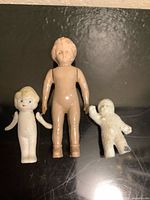 Front view of all three miniature figures side by side
