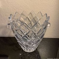 front view of cut glass ice bucket showing diamond pattern and handles