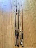 Five rods laid side by side showing full length and handles