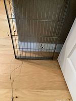 Rectangular metal grid frame pot rack with attached cables