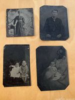 Overview of the four tintype photographs laid out