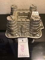 Overall view of Nordic Ware castle Bundt pan with reference tag