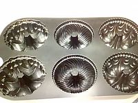 Top view of Nordic Ware Garland Bundtlette pan showing six decorative bundt cups