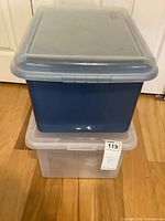 Blue bin stacked on clear bin showing size and colors