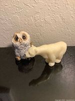 Front view showing both figurines together