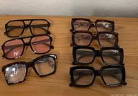 Eight pairs reading glasses arranged in two columns