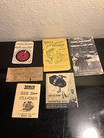 Overview of all six fishing ephemera items laid out