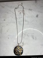 Full view of necklace showing chain length and pendant