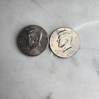 Two Kennedy half dollars obverse view