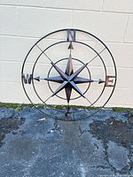 Full view of the 32 in metal compass rose wall decor