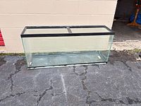 Full view of rectangular glass aquarium on pavement