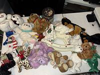 Overhead view of entire lot displaying assorted plush animals and rocking horse